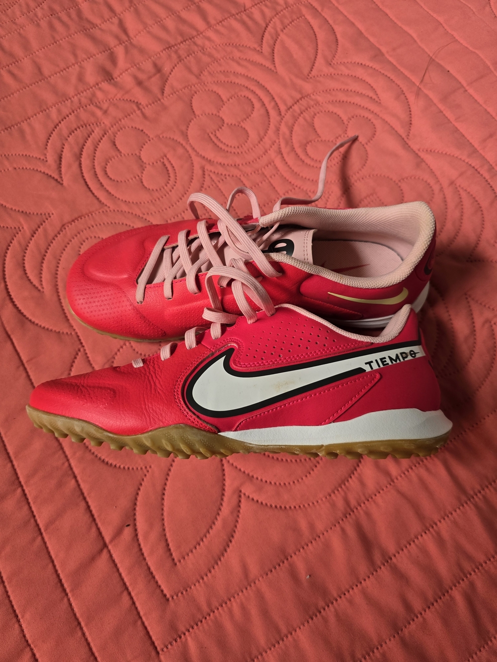 Bright red Nike Tiempo Legend 9 Academy Turf soccer shoes with a white swoosh